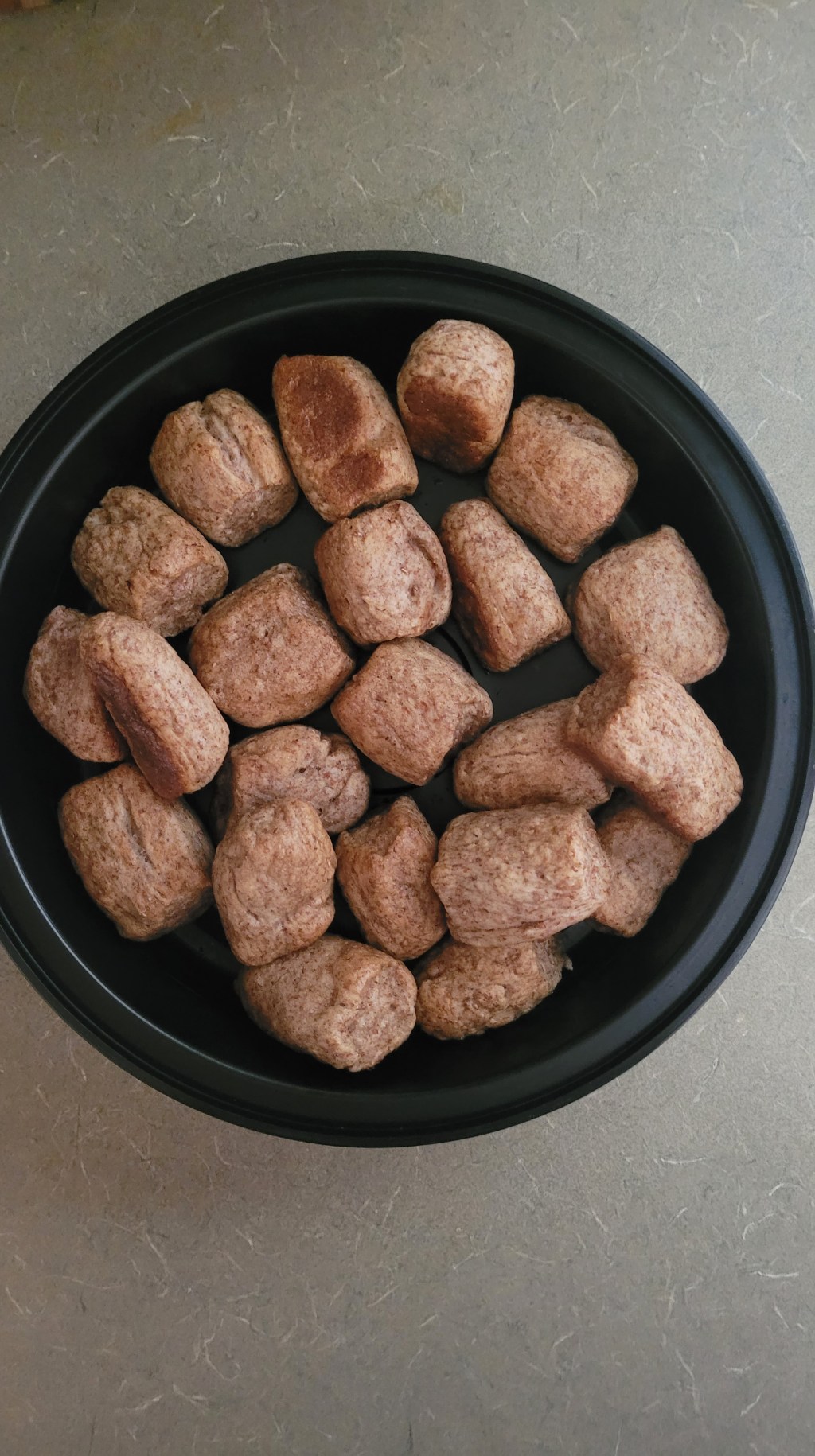 pretzel nuggets in a round black takeaway container